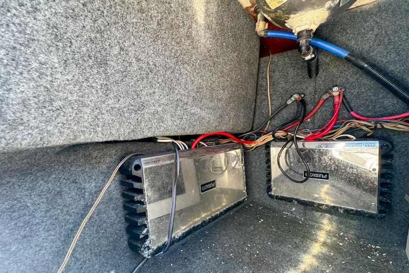 Slide: The Image of Electrical wiring and amplifiers inside a 2007 Sea Ray 240 Sundancer boat. - 31