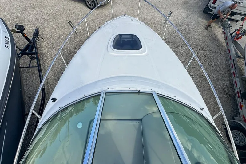 Slide: The Image of 2007 Sea Ray 240 Sundancer boat viewed from above, showing deck and windshield. - 53
