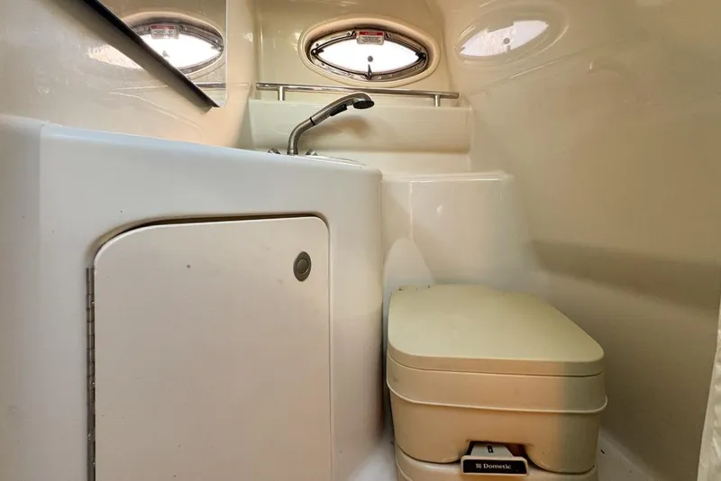 Slide: The Image of 2007 Sea Ray 240 Sundancer boat bathroom with sink and toilet. - 82