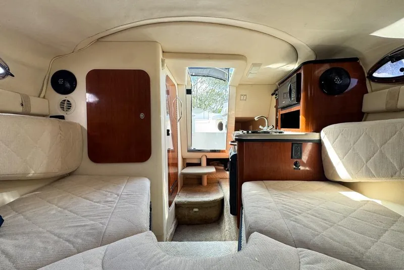 Slide: The Image of Interior of 2007 Sea Ray 240 Sundancer boat with seating and kitchenette. - 96