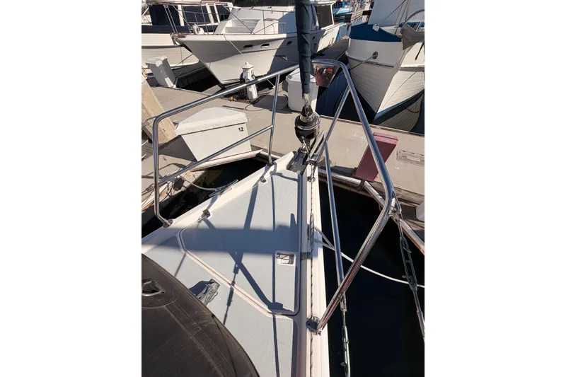 Slide: The Image of Bow view of 2005 Hunter Passage 456 sailboat docked at marina. - 16