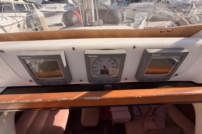 Slide: The Image of Control panel of a 2005 Hunter Passage 456 sailboat with Raymarine instruments. - 30