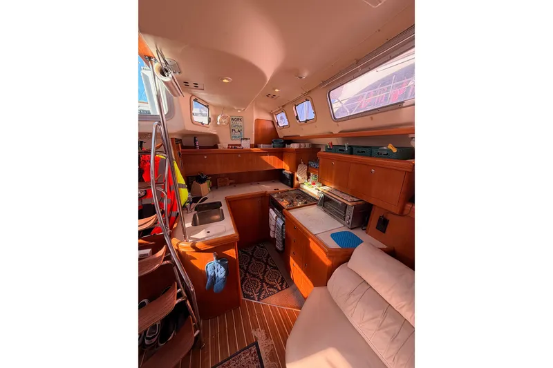 Slide: The Image of Interior of 2005 Hunter Passage 456 yacht with kitchen and seating area. - 35