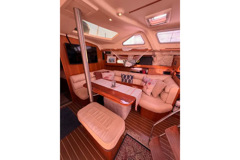 Slide: The Image of Luxurious interior of 2005 Hunter Passage 456 yacht with cozy seating and elegant decor. - 50