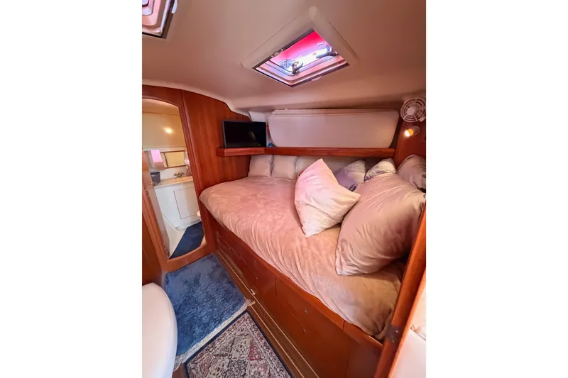 Slide: The Image of Cozy cabin interior of 2005 Hunter Passage 456 yacht with bed and skylight. - 54