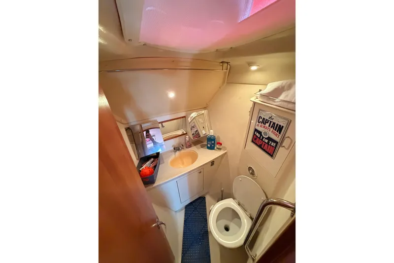 Slide: The Image of Bathroom interior of 2005 Hunter Passage 456 yacht with sink and toilet. - 58
