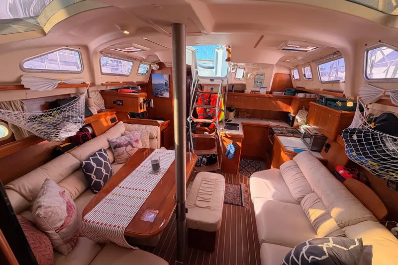 Slide: The Image of Luxurious interior of 2005 Hunter Passage 456 yacht with cozy seating and elegant wood finishes. - 62