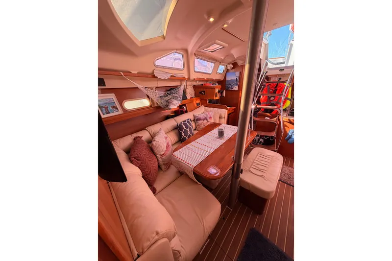Slide: The Image of Interior of 2005 Hunter Passage 456 yacht with cozy seating and wooden accents. - 63