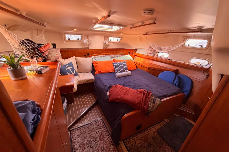 Slide: The Image of Cozy cabin interior of 2005 Hunter Passage 456 yacht with bed and nautical decor. - 68