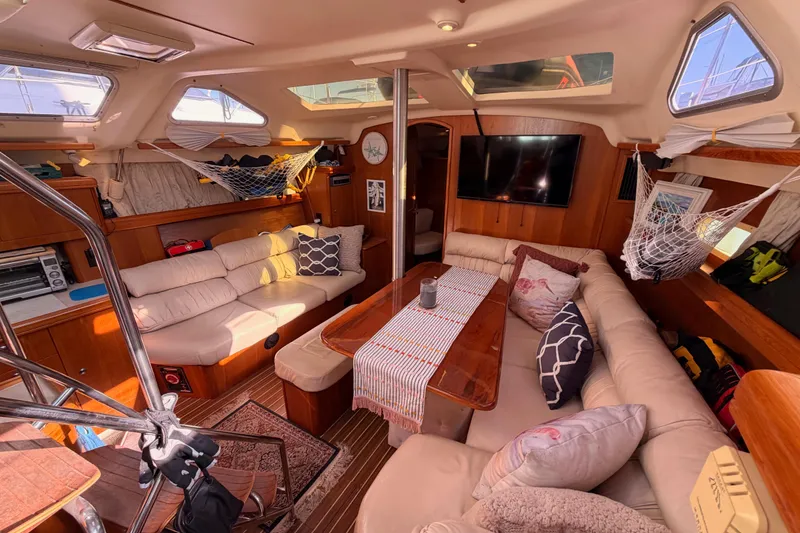 Slide: The Image of Luxurious interior of 2005 Hunter Passage 456 yacht with cozy seating and elegant decor. - 80