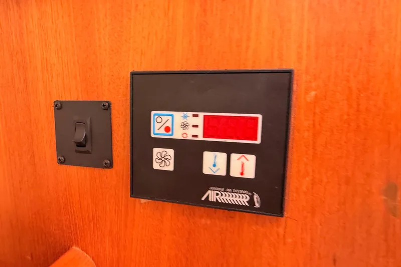 Slide: The Image of Control panel on a 2005 Hunter Passage 456 yacht interior. - 84