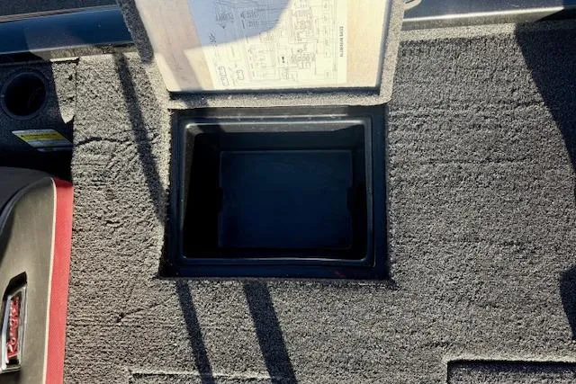 Slide: The Image of 2017 Ranger RT198P boat storage compartment with open lid and visible interior. - 12