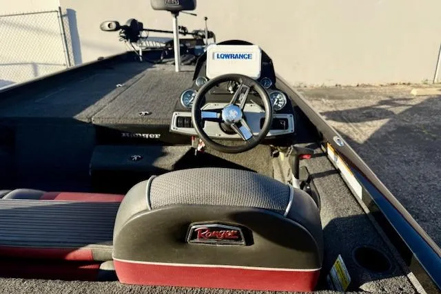 Slide: The Image of 2017 Ranger RT198P boat interior with steering wheel and Lowrance electronics. - 13