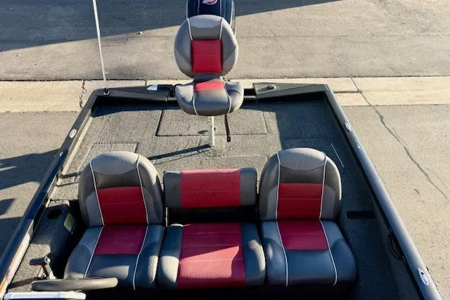 Slide: The Image of 2017 Ranger RT198P boat interior with red and gray seating, viewed from above. - 14