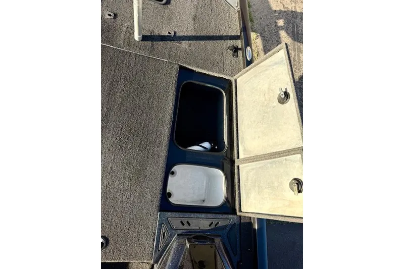 Slide: The Image of 2017 Ranger RT198P boat storage compartments with open lids, showcasing interior space. - 19