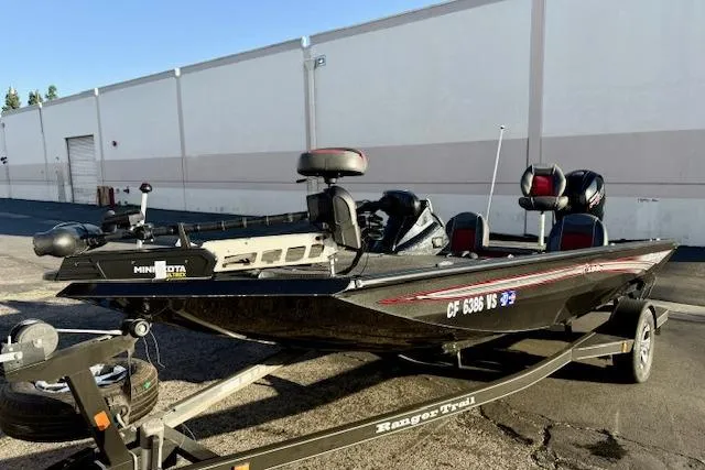 Slide: The Image of 2017 Ranger RT198P fishing boat on trailer, parked outdoors. - 2