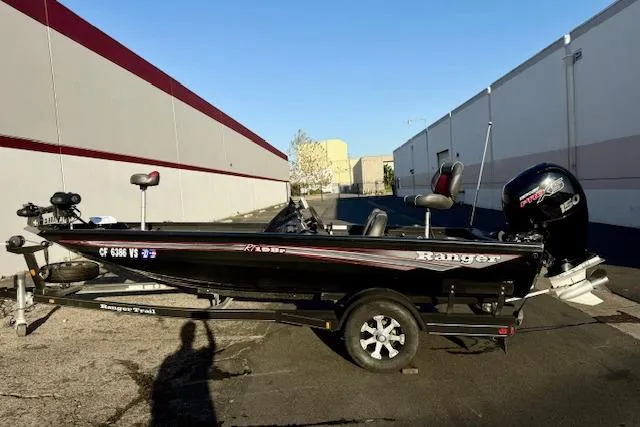 Slide: The Image of 2017 Ranger RT198P fishing boat on trailer, parked outdoors. - 4
