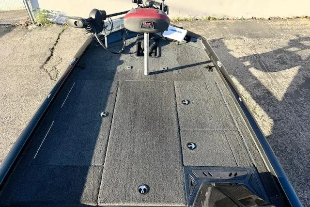Slide: The Image of 2017 Ranger RT198P boat deck with carpeted surface and mounted trolling motor. - 8