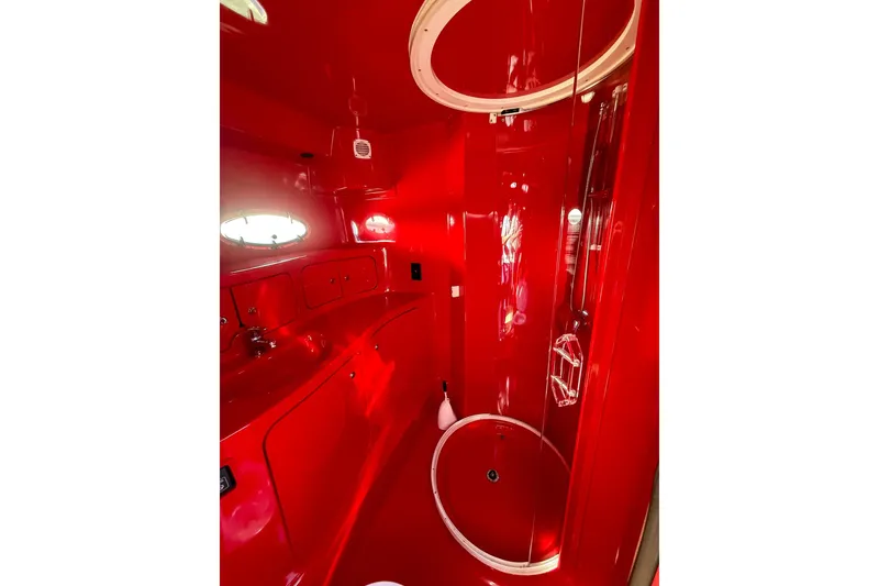 Slide: The Image of Red bathroom interior of 2002 Hallett Custom High Performance Express Cruiser. - 13