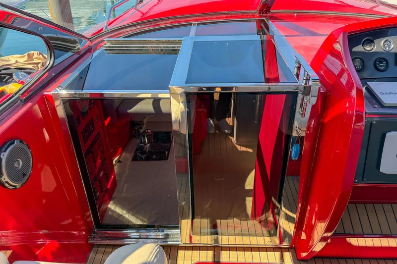 Slide: The Image of Red 2002 Hallett Custom High Performance Express Cruiser interior with sleek design and modern controls. - 20