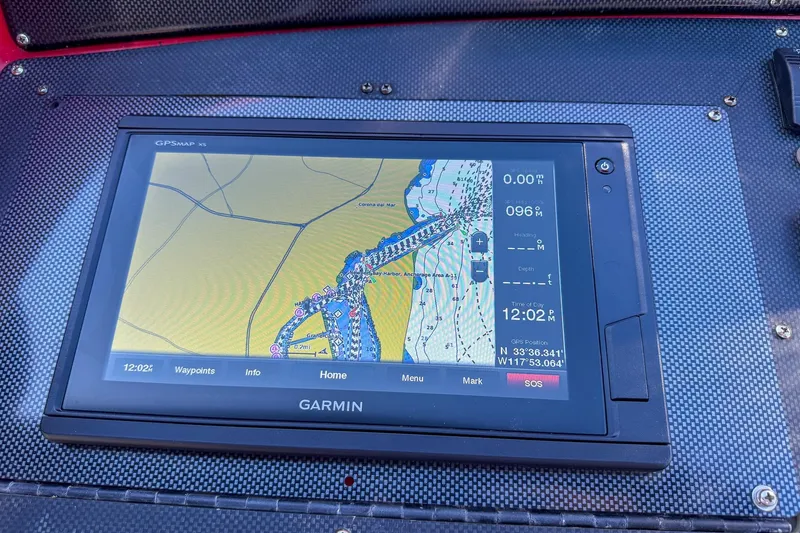 Slide: The Image of Garmin GPS display on 2002 Hallett Custom High Performance Express Cruiser dashboard. - 21