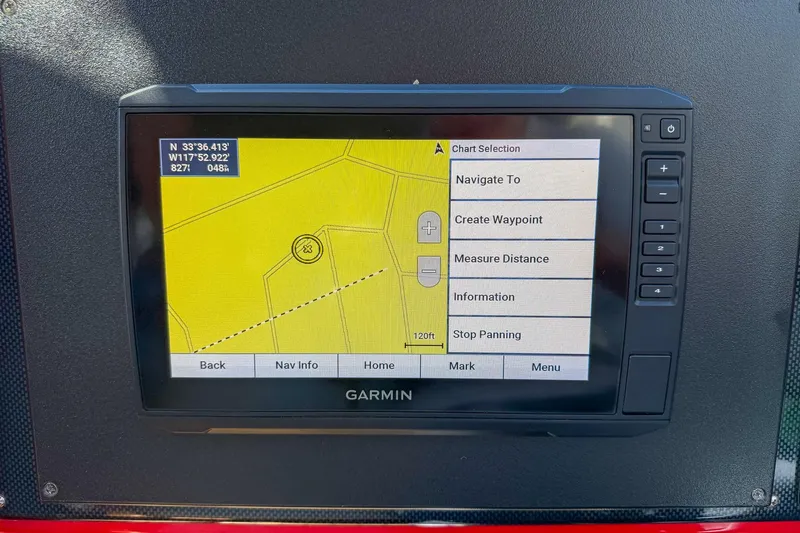 Slide: The Image of Garmin navigation system on 2002 Hallett Custom High Performance Express Cruiser displaying map coordinates. - 22