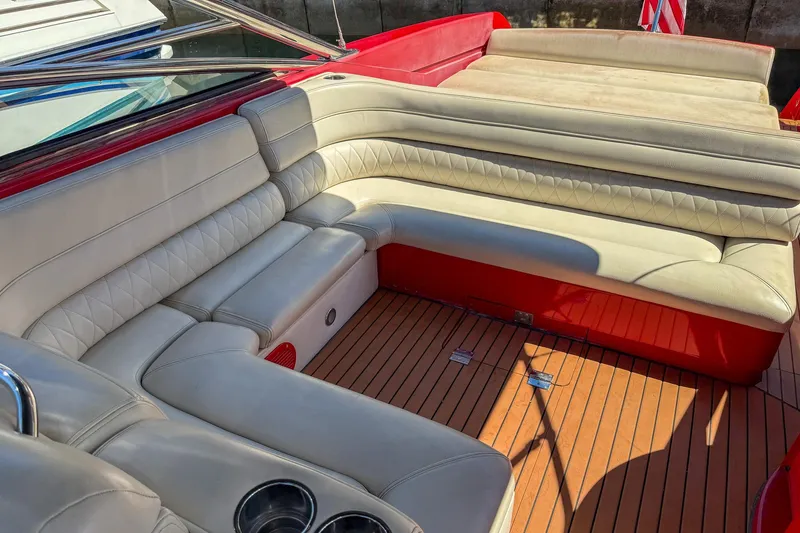 Slide: The Image of Luxurious seating on 2002 Hallett Custom High Performance Express Cruiser with red accents. - 29