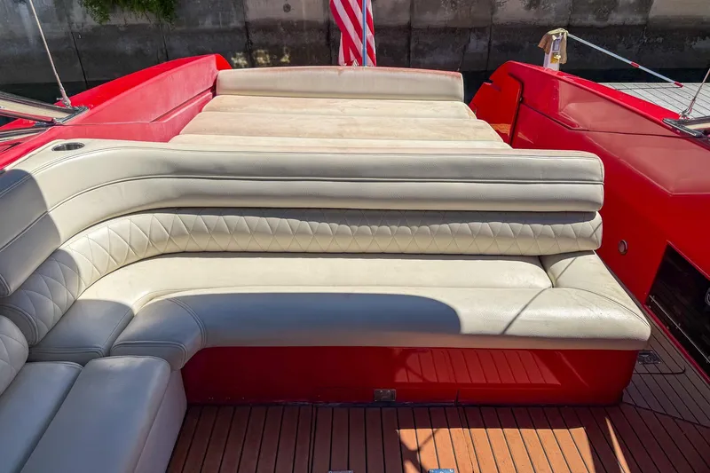 Slide: The Image of Luxurious seating on 2002 Hallett Custom High Performance Express Cruiser with red accents. - 30