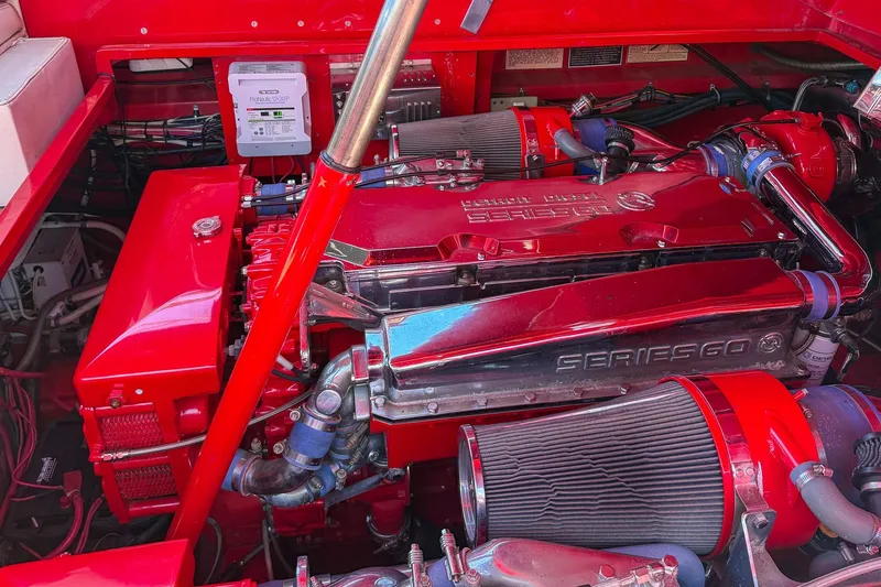 Slide: The Image of Engine of 2002 Hallett Custom High Performance Express Cruiser, featuring vibrant red components. - 37
