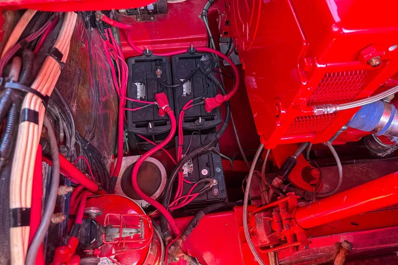 Slide: The Image of Engine compartment of a 2002 Hallett Custom High Performance Express Cruiser with visible batteries. - 40
