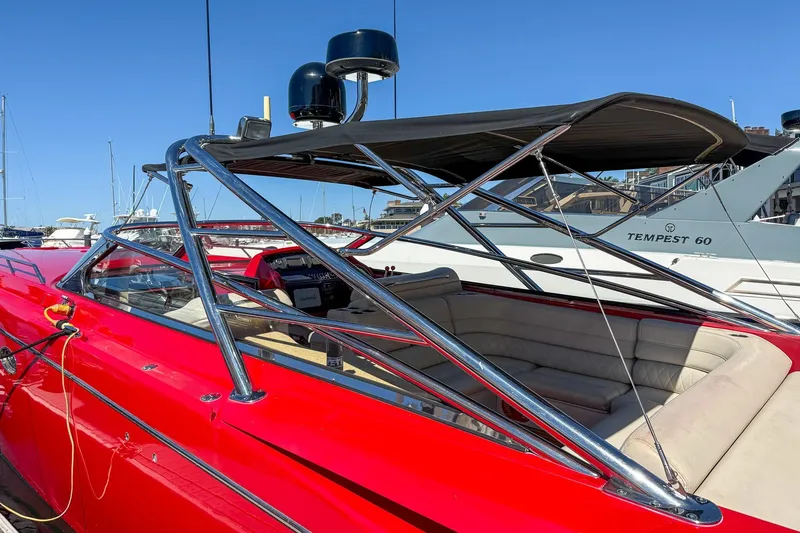 Slide: The Image of 2002 Hallett Custom High Performance Express Cruiser with sleek red design and chrome accents. - 43