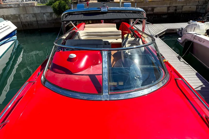 Slide: The Image of Red 2002 Hallett Custom High Performance Express Cruiser docked at marina. - 44
