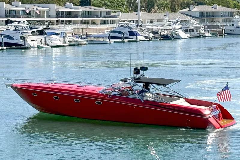 Slide: The Image of Red 2002 Hallett Custom High Performance Express Cruiser docked in a marina. - 51