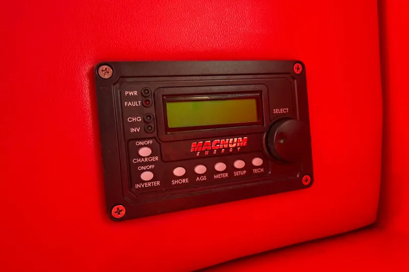 Slide: The Image of Control panel of a 2002 Hallett Custom High Performance Express Cruiser, featuring Magnum Energy display. - 63