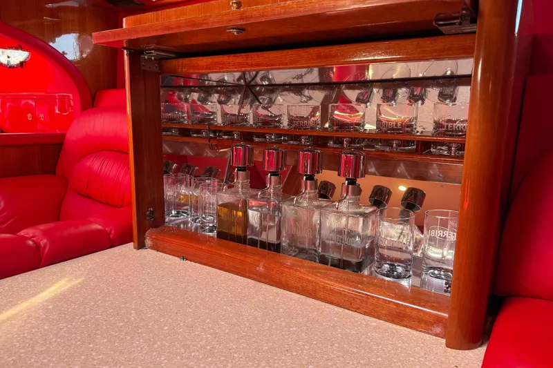 Slide: The Image of Luxurious bar setup inside a 2002 Hallett Custom High Performance Express Cruiser. - 67
