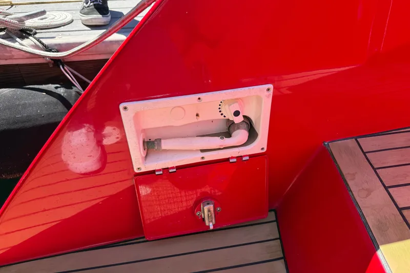 Slide: The Image of Red 2002 Hallett Custom High Performance Express Cruiser with deck fittings and hose compartment. - 74