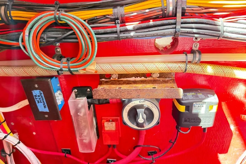 Slide: The Image of Electrical wiring and components inside a 2002 Hallett Custom High Performance Express Cruiser. - 78
