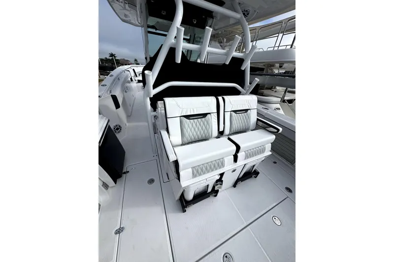Slide: The Image of 2026 Blackfin 332 CC boat interior with white seating and modern design. - 6