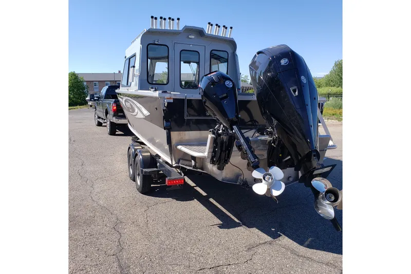 Slide: The Image of 2019 Hewescraft 220 Ocean Pro ET Hardtop boat on trailer, dual outboard motors. - 10