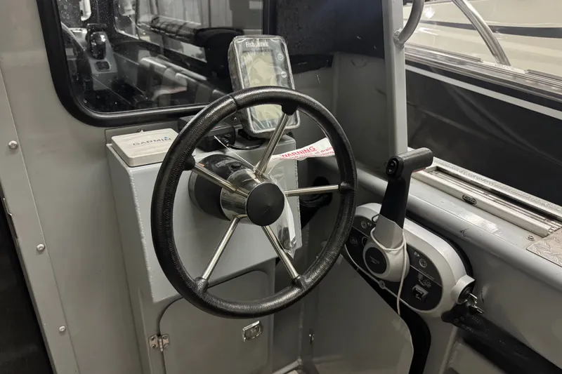 Slide: The Image of Steering wheel and controls of 2019 Hewescraft 220 Ocean Pro ET Hard Top boat. - 19