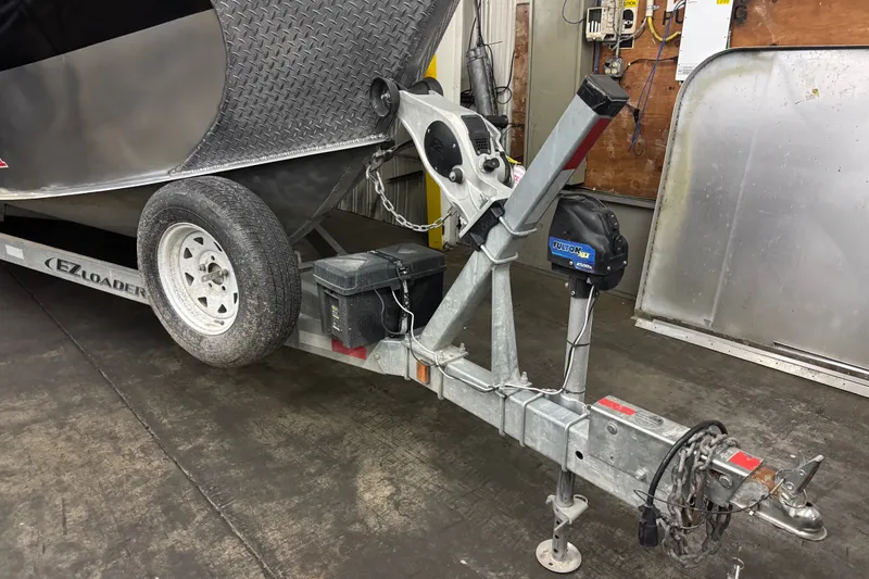 Slide: The Image of Trailer for 2019 Hewescraft 220 Ocean Pro ET Hard Top boat in garage. - 14