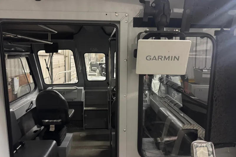 Slide: The Image of 2019 Hewescraft 220 Ocean Pro ET Hard Top interior with Garmin navigation system. - 20