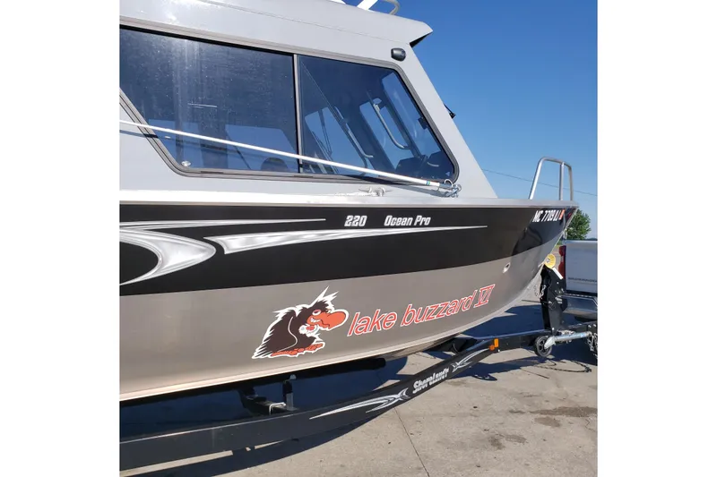 Slide: The Image of 2019 Hewescraft 220 Ocean Pro ET Hardtop boat on trailer, side view. - 8