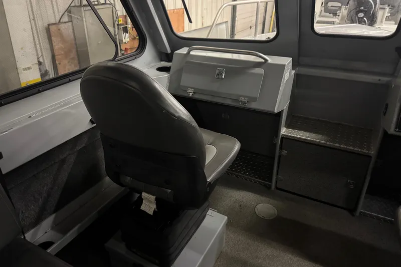 Slide: The Image of Interior of 2019 Hewescraft 220 Ocean Pro ET Hard Top, featuring seating and storage compartments. - 26