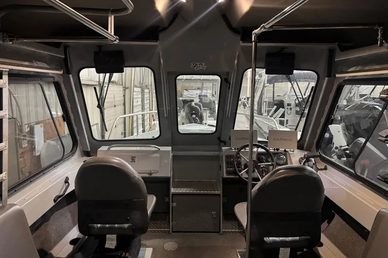 Slide: The Image of Interior of a 2019 Hewescraft 220 Ocean Pro ET Hard Top boat with Garmin equipment. - 31