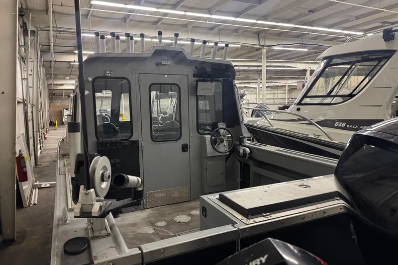 Slide: The Image of 2019 Hewescraft 220 Ocean Pro ET Hard Top boat in indoor storage facility. - 18