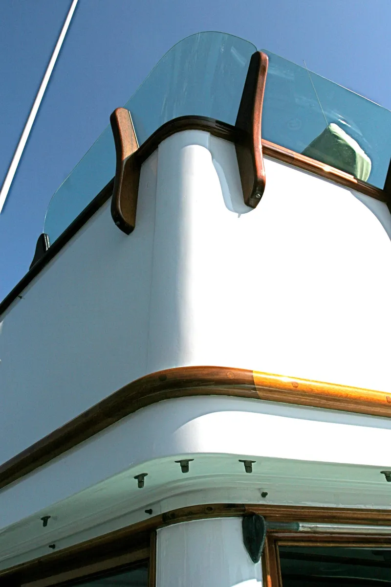 Slide: The Image of Detail view of a classic yacht with wood trim, built in 1946. - 10