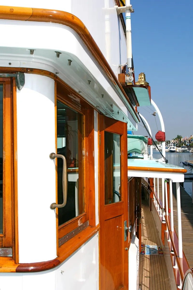 Slide: The Image of 1946 classic yacht with wooden details on deck. - 13