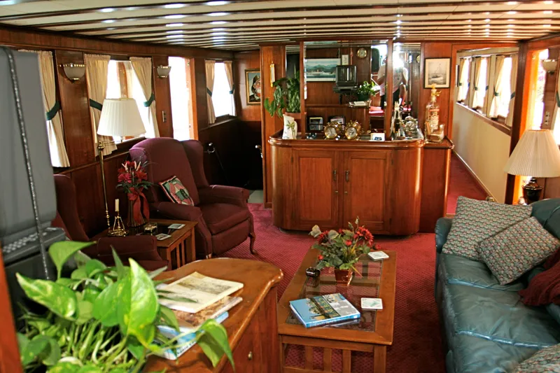 Slide: The Image of Interior of a classic yacht with wooden furnishings and plants, built in 1946. - 27