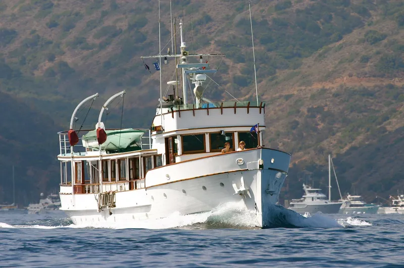 Slide: The Image of Classic 1946 J.M. Martinac motor yacht cruising on water. - 3